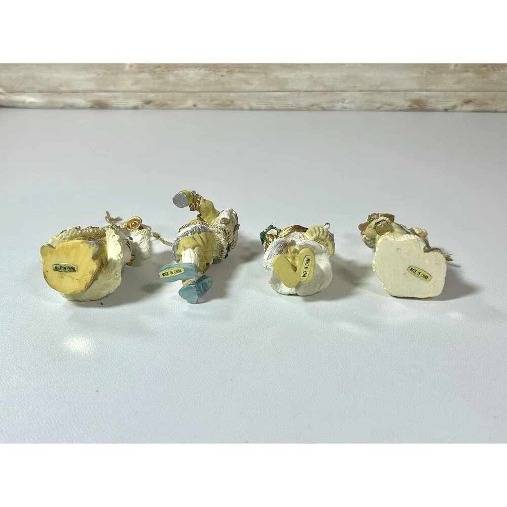 Lot of 4 Santa Figures Christmas Ornaments White Cream Gold Coats Decor